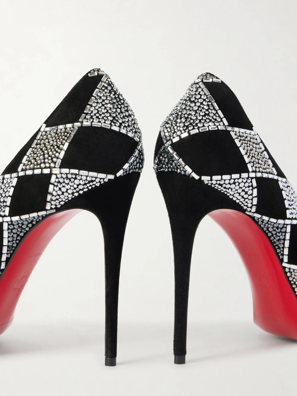 Close-up detail of the Christian Louboutin Doria 100 Crystal-embellished Suede Pumps