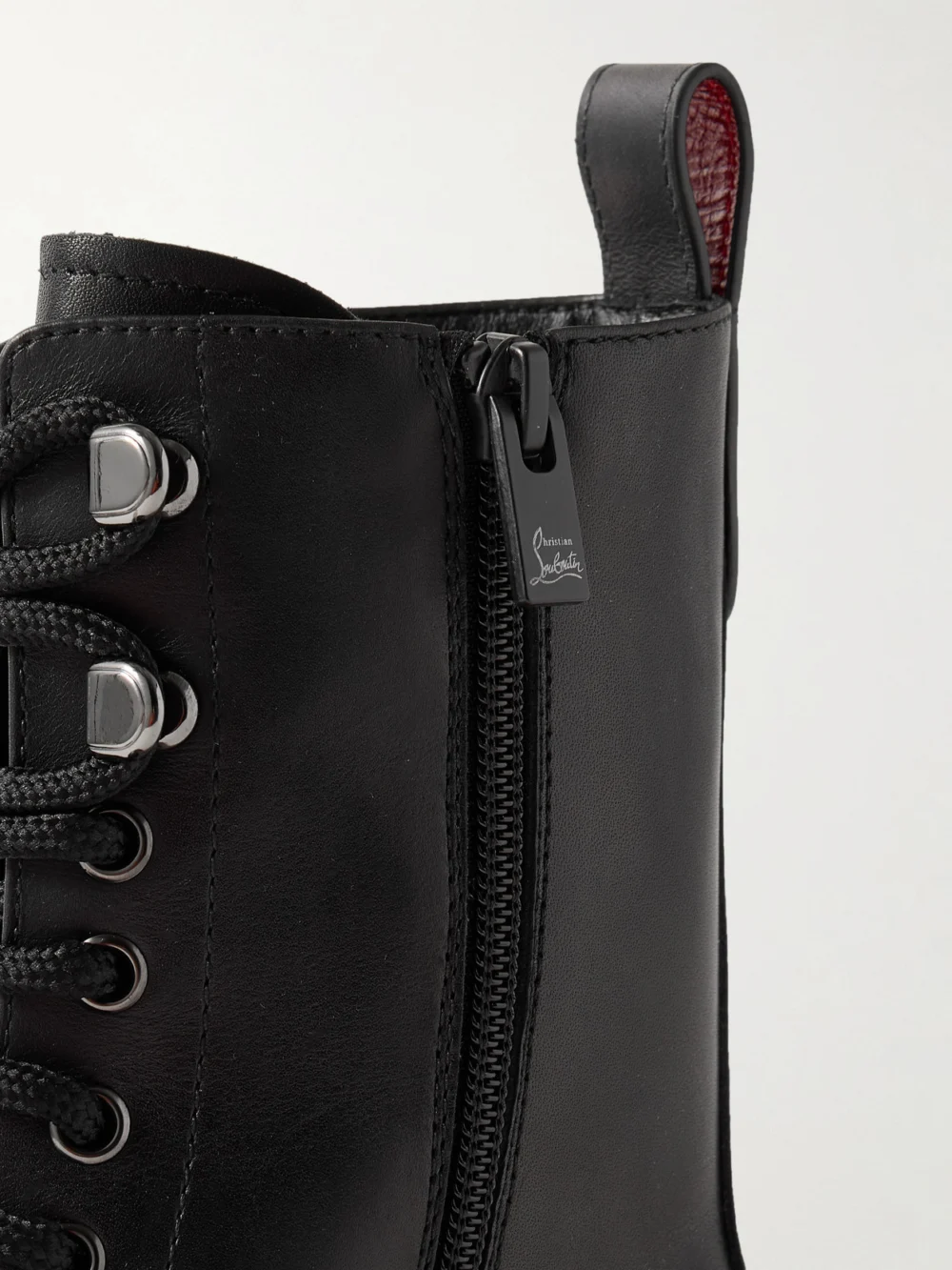 Close-up detail of the Christian Louboutin Dune Trott Alta Leather Ankle Boots