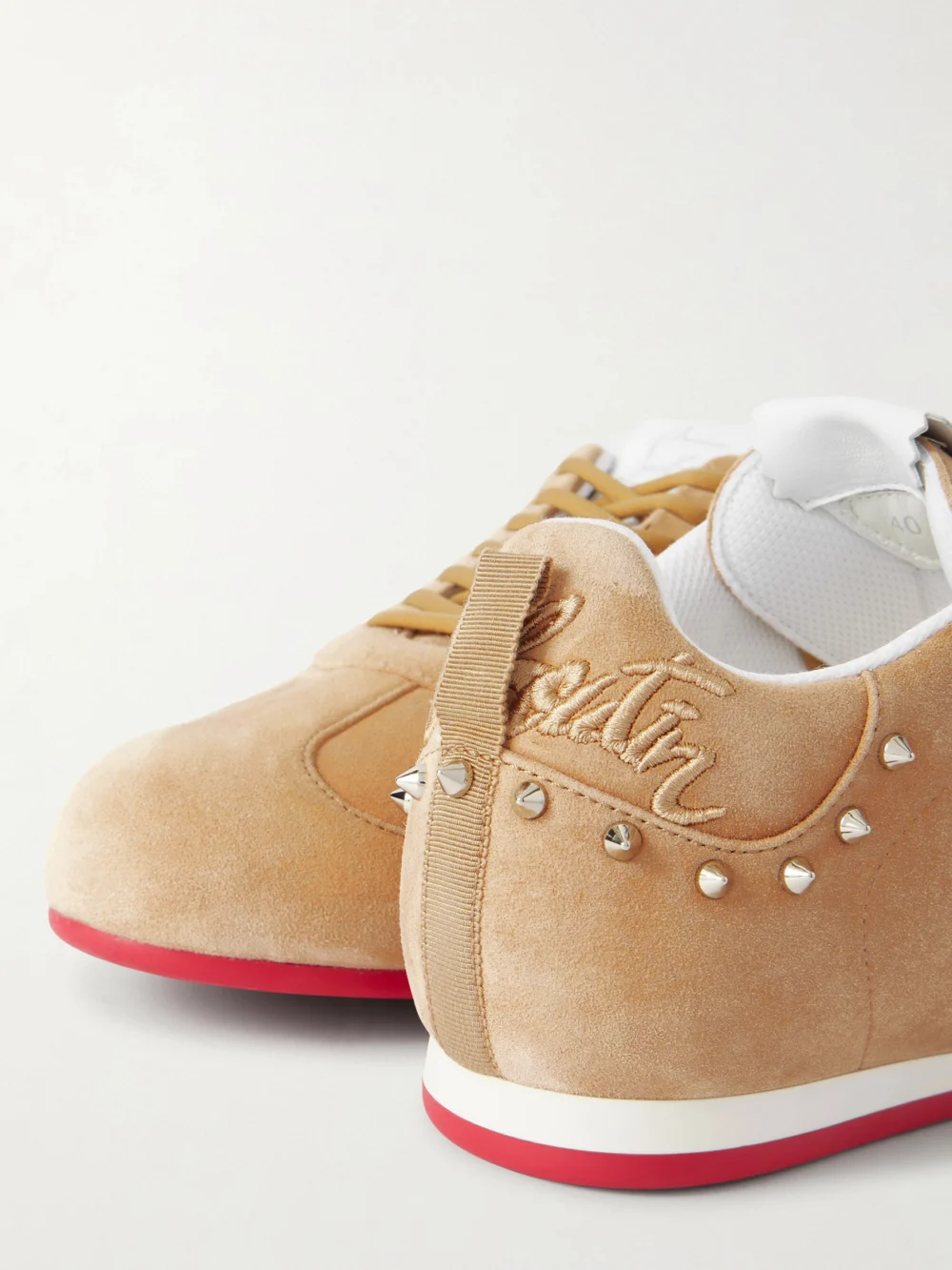Close-up detail of the Christian Louboutin Eleonora Studded Leather-trimmed Suede Sneakers