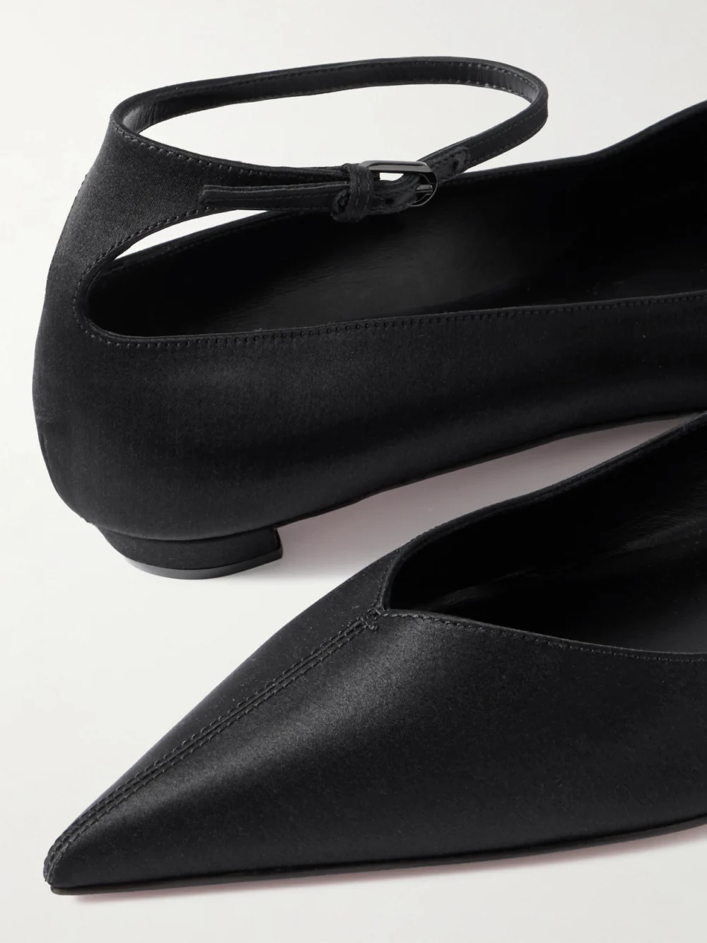 Close-up detail of the Christian Louboutin Erozeena Satin Point-toe Flats