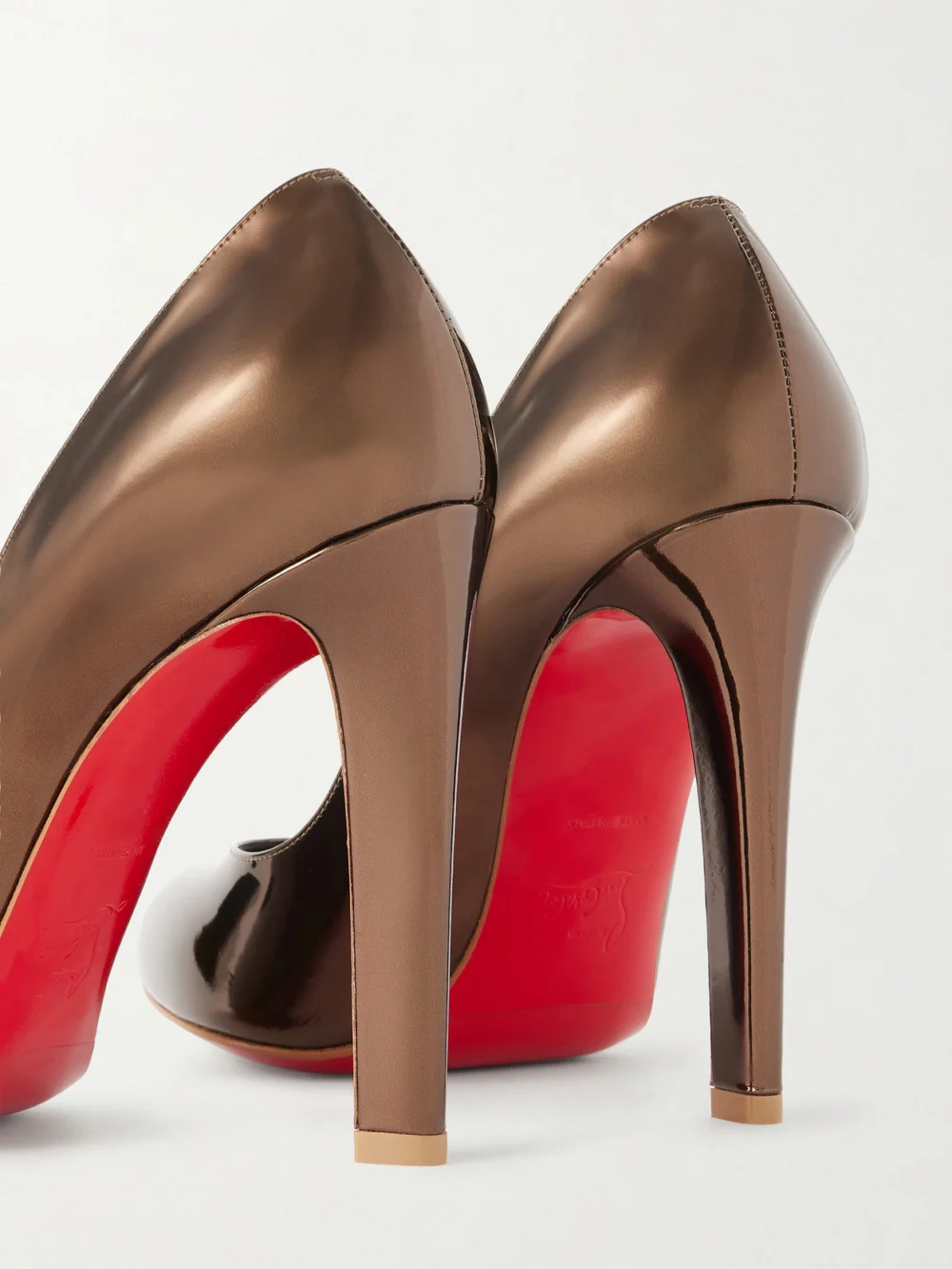 Close-up detail of the Christian Louboutin Fannylove 100 Metallic Patent-leather Pumps