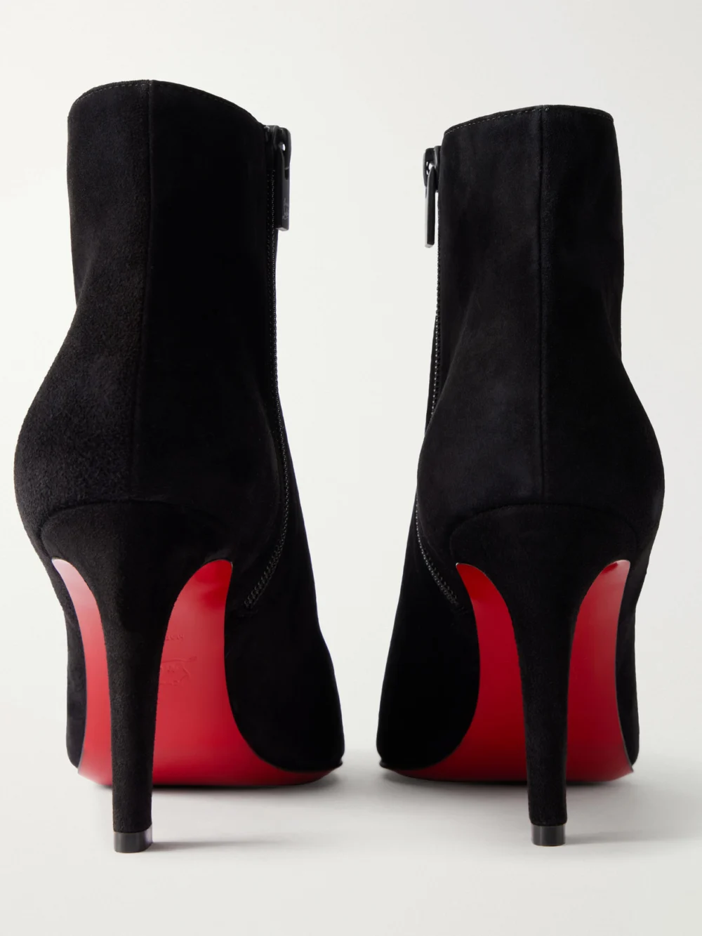 Close-up detail of the Christian Louboutin Fannylove 85 Suede Ankle Boots