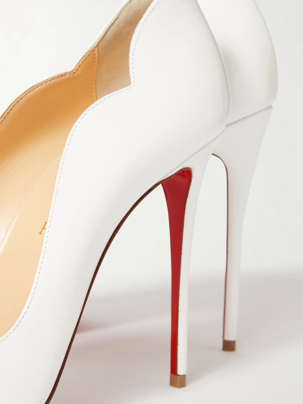 Close-up detail of the Christian Louboutin Hot Chick 100 Patent-leather Pumps