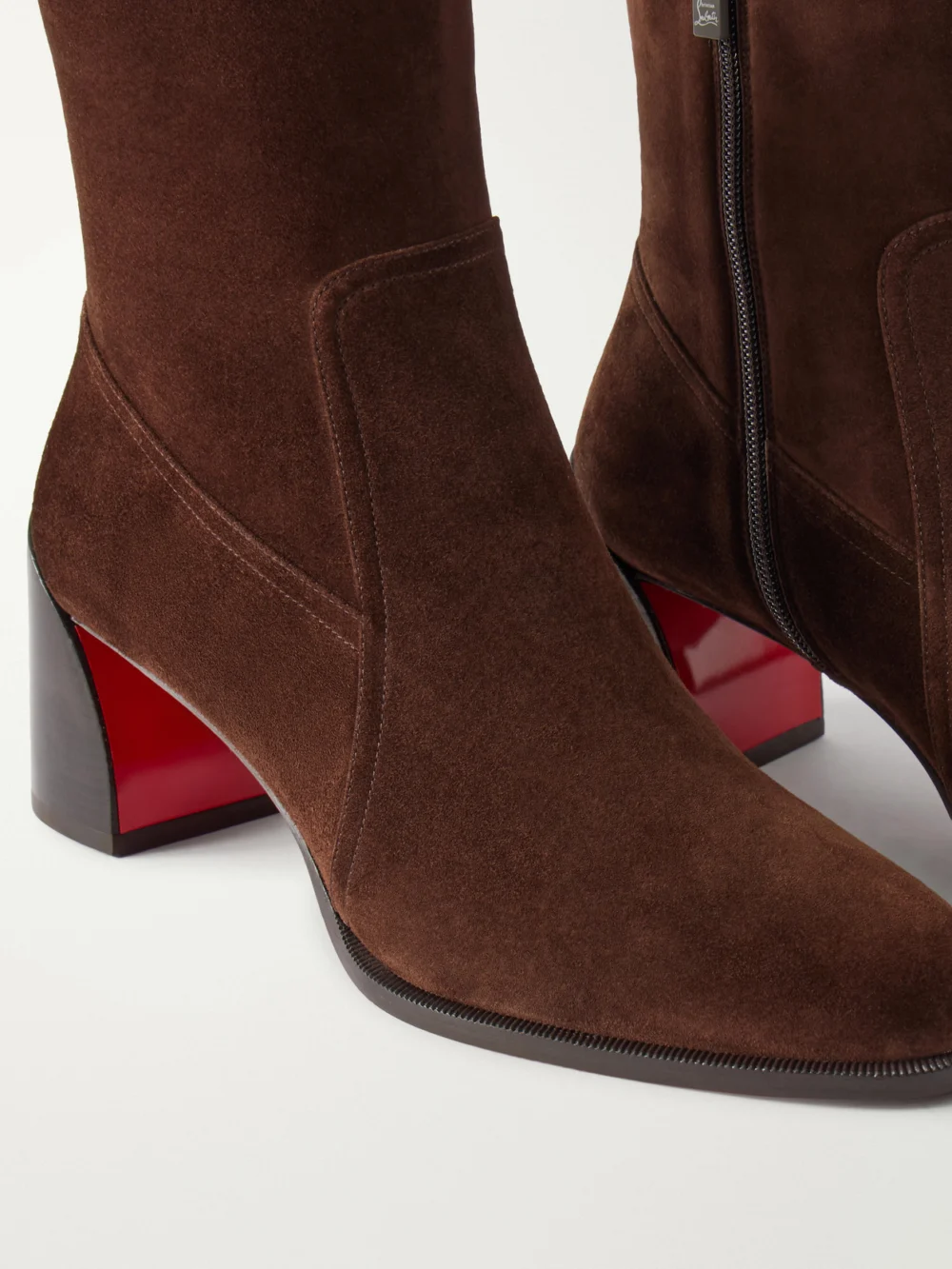 Close-up detail of the Christian Louboutin Ira 55 Suede Ankle Boots