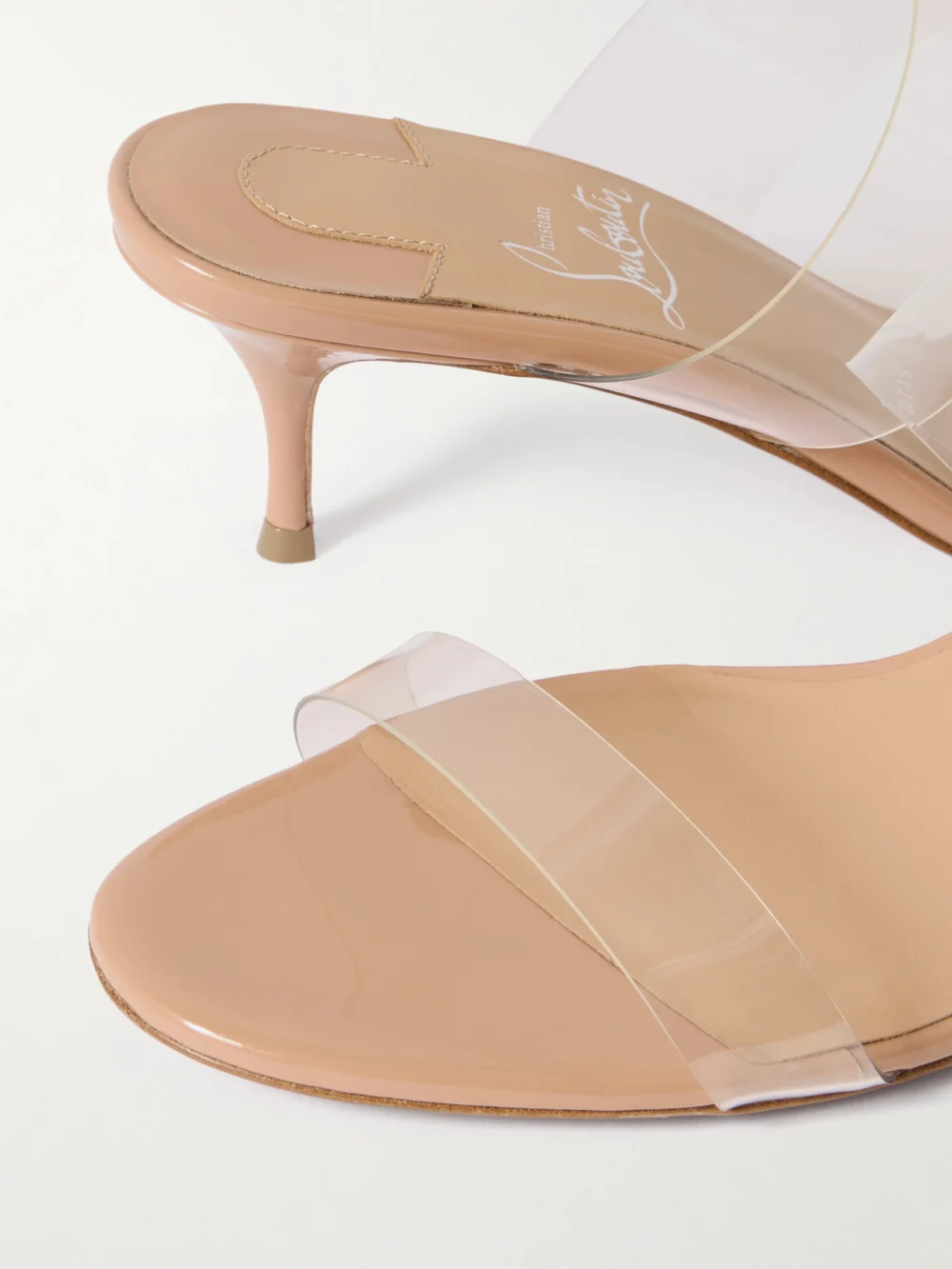 Close-up detail of the Christian Louboutin Just Nothing 55 Pvc Mules