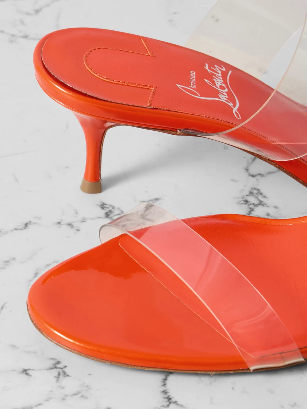 Close-up detail of the Christian Louboutin Just Nothing 55 Pvc Mules