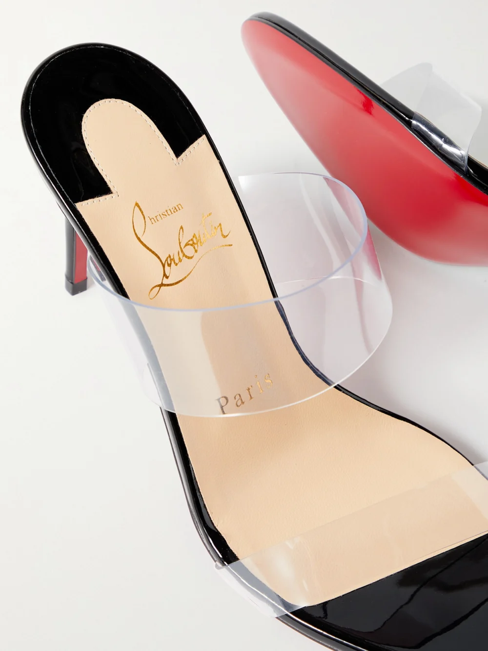 Close-up detail of the Christian Louboutin Just Nothing 85 Pvc and Patent-leather Mules