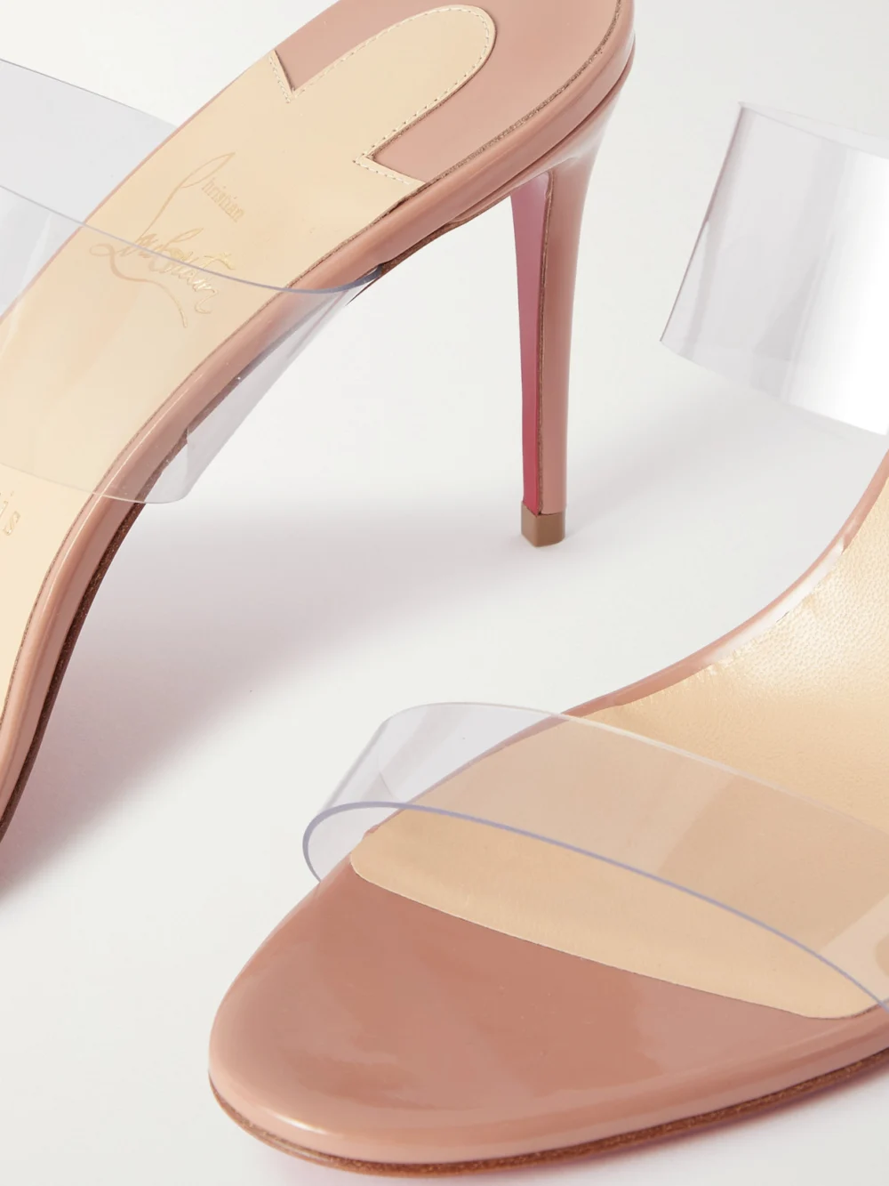 Close-up detail of the Christian Louboutin Just Nothing 85 Pvc and Patent-leather Mules
