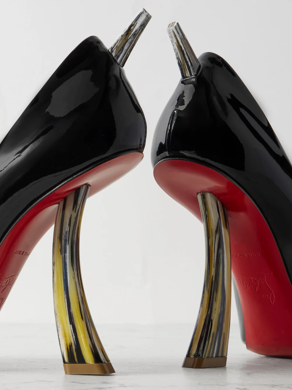 Close-up detail of the Christian Louboutin Kate Clawmax 100 Spiked Patent-leather Pumps