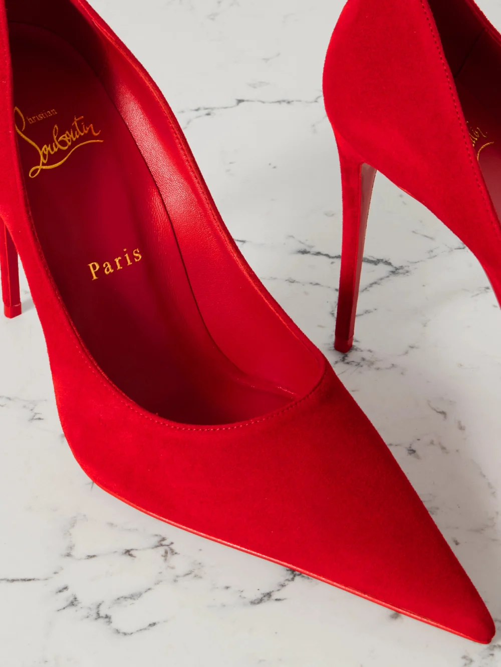Close-up detail of the Christian Louboutin Kate Max 100 Suede Point-toe Pumps