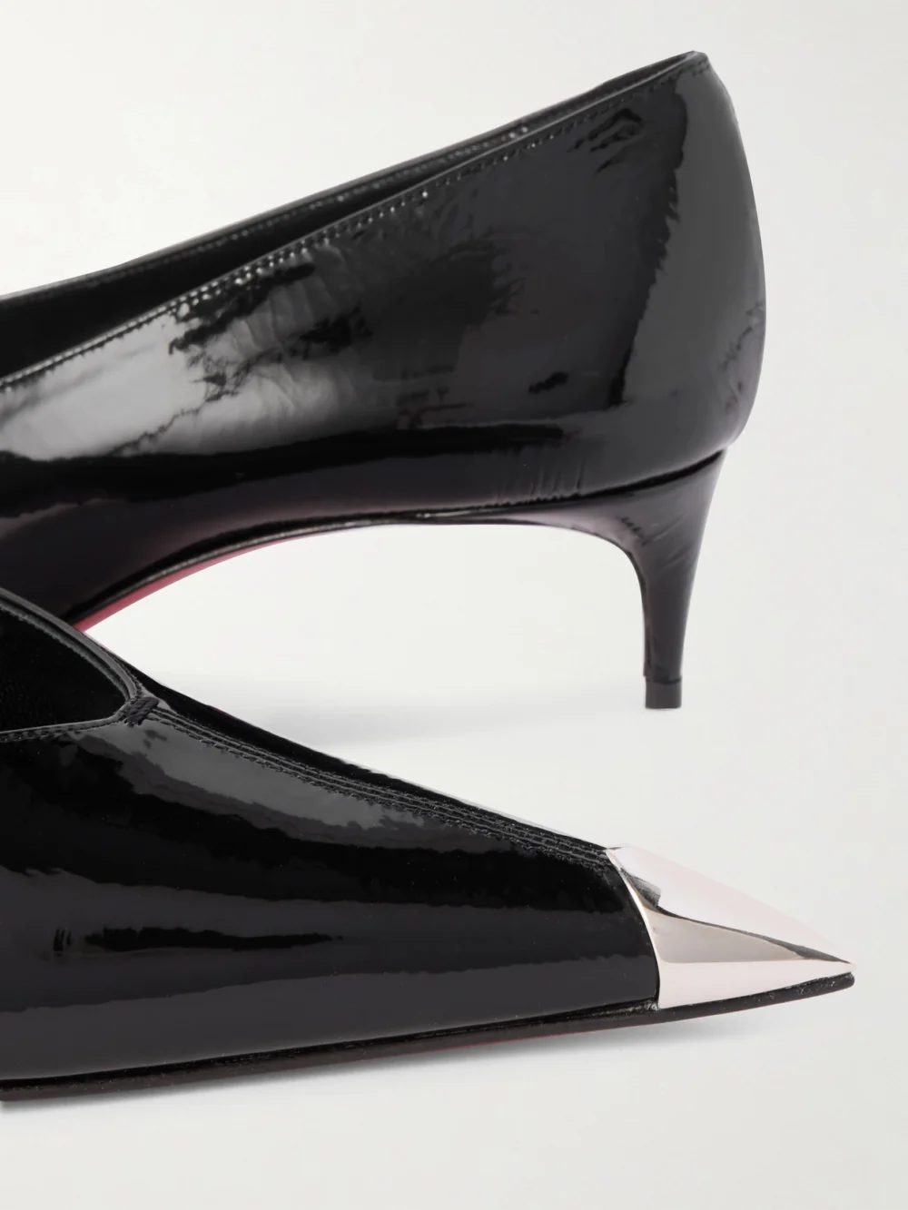 Close-up detail of the Christian Louboutin Katissima 45 Embellished Patent-leather Point-toe Pumps