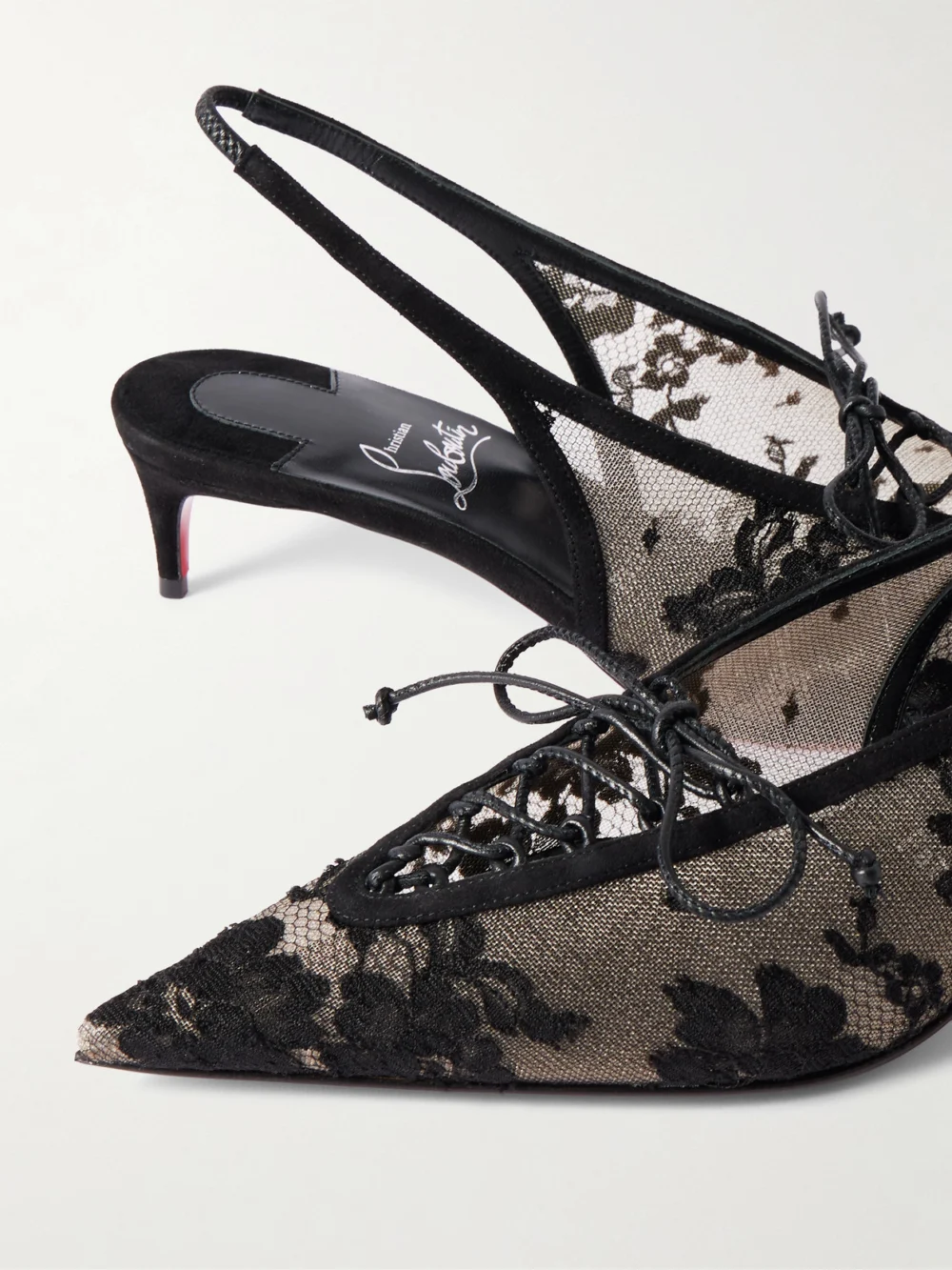 Close-up detail of the Christian Louboutin Km 45 Lace Slingback Pumps