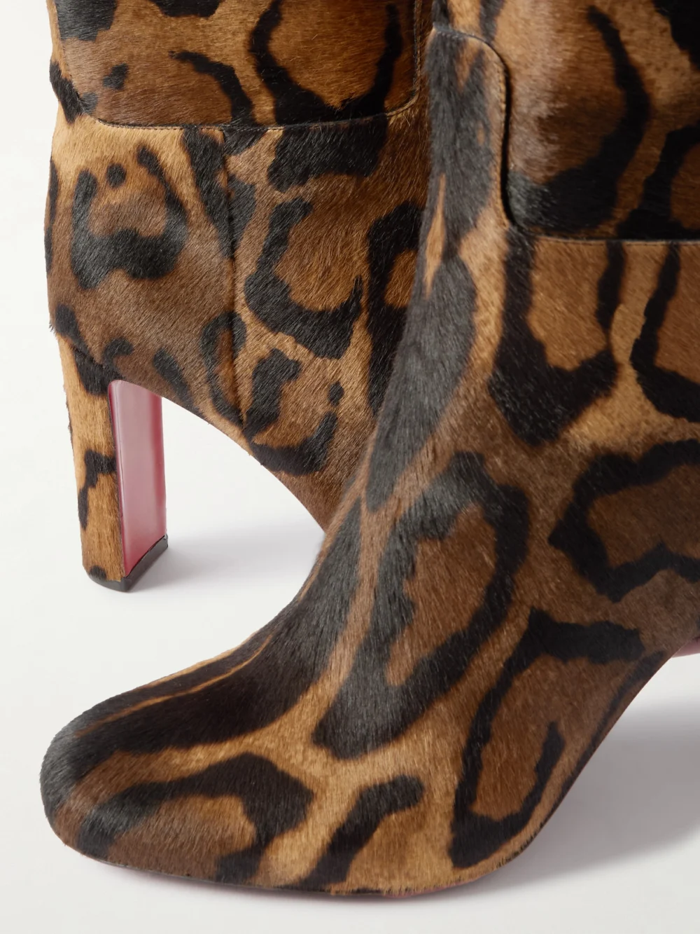 Close-up detail of the Christian Louboutin Loo Botta 85 Leopard-print Calf Hair Knee Boots