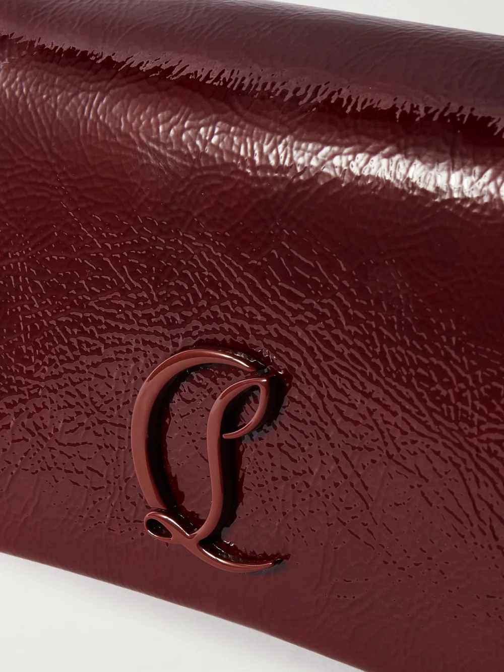 Close-up detail of the Christian Louboutin Loubi54 Embellished Crinkled Patent-leather Shoulder Bag