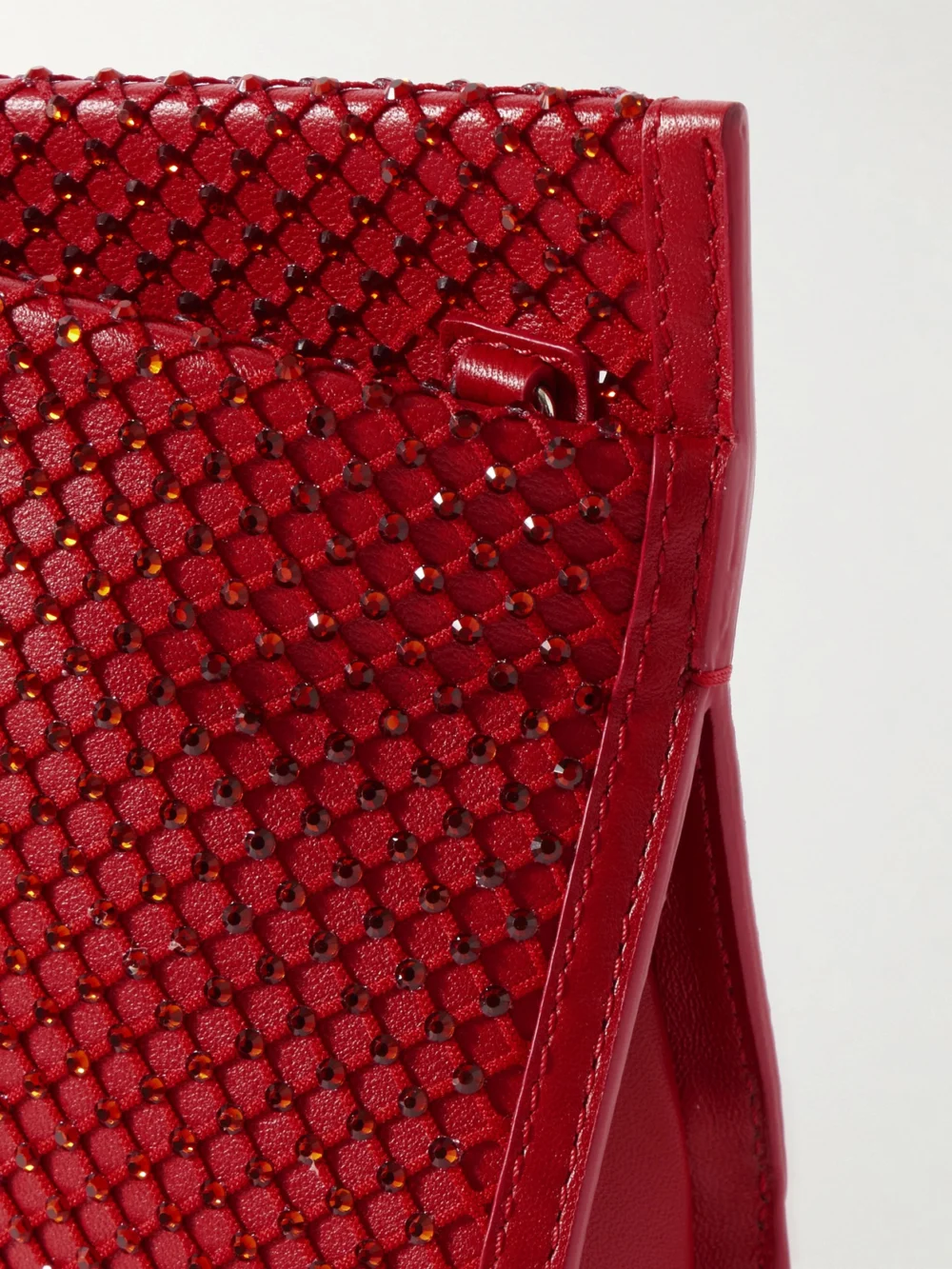 Close-up detail of the Christian Louboutin Loubitwist Crystal-embellished Leather Clutch