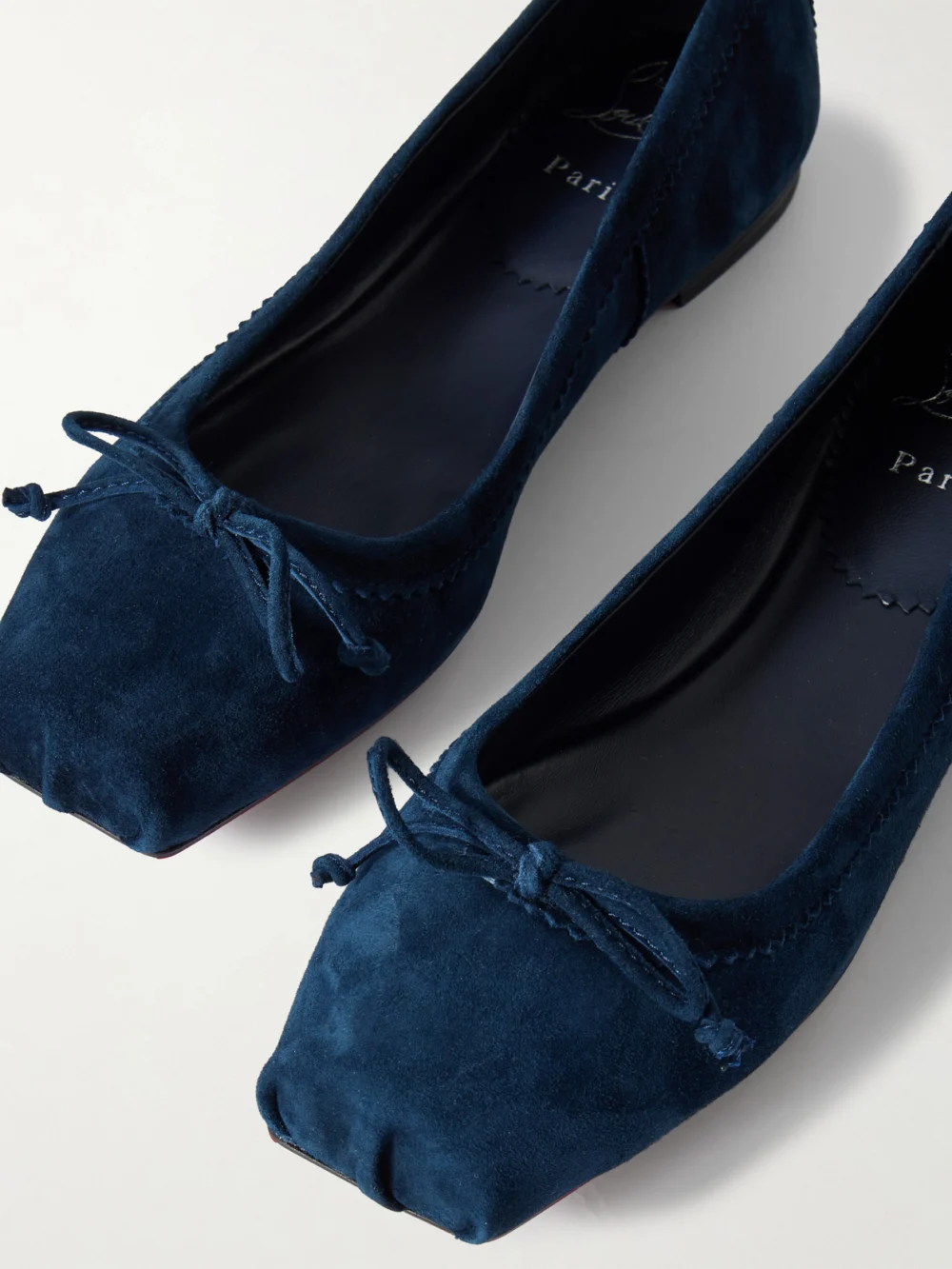Close-up detail of the Christian Louboutin Mamadrague Suede Ballet Flats