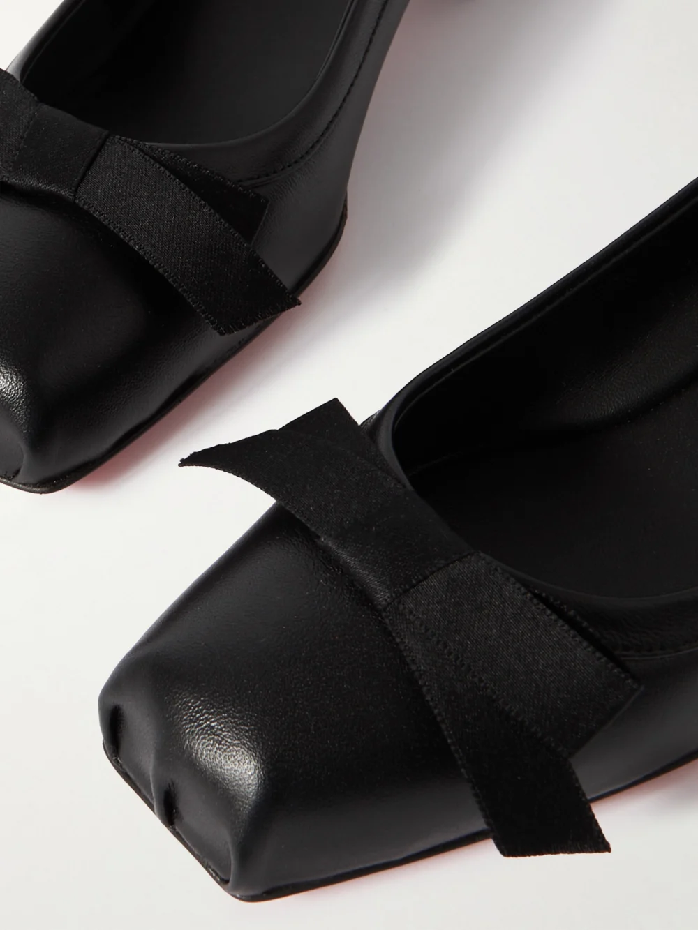 Close-up detail of the Christian Louboutin Mamaflirt 30 Bow-embellished Leather Ballet Pumps