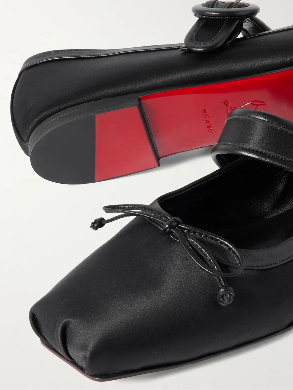 Close-up detail of the Christian Louboutin Mamastrapitina Leather-trimmed Satin-crepe Ballet Flats