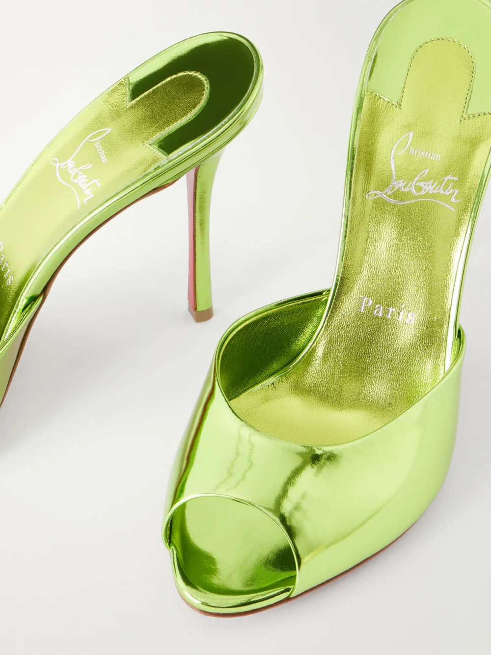 Close-up detail of the Christian Louboutin Me Dolly 100 Metallic Leather Mules