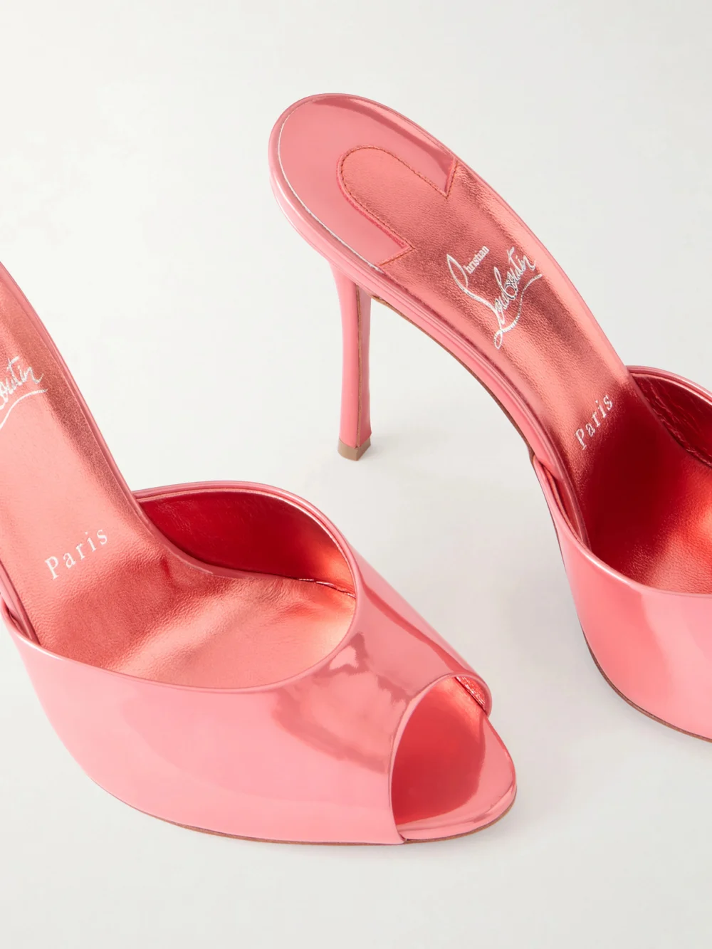 Close-up detail of the Christian Louboutin Me Dolly 100 Mirrored-leather Mules