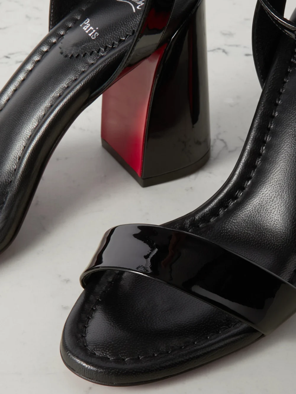 Close-up detail of the Christian Louboutin Miss Sabina 85 Patent-leather Sandals