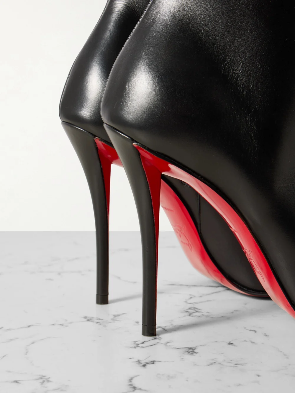 Close-up detail of the Christian Louboutin Miss Z 100 Leather Ankle Boots