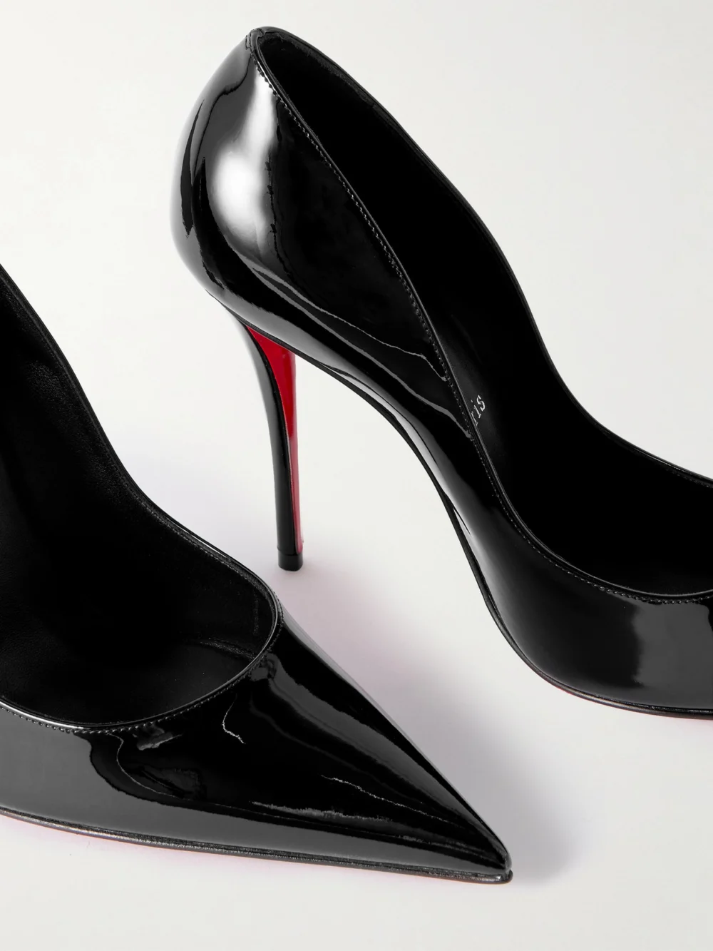 Close-up detail of the Christian Louboutin Miss Z 100 Patent-leather Pumps