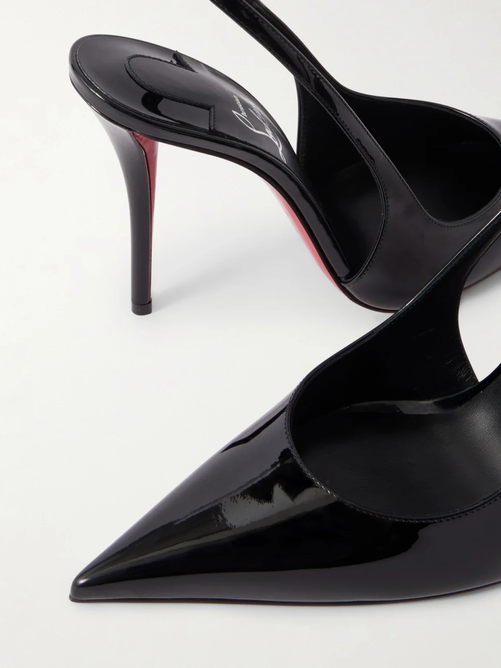 Close-up detail of the Christian Louboutin Miss Z 100 Patent-leather Slingback Pumps