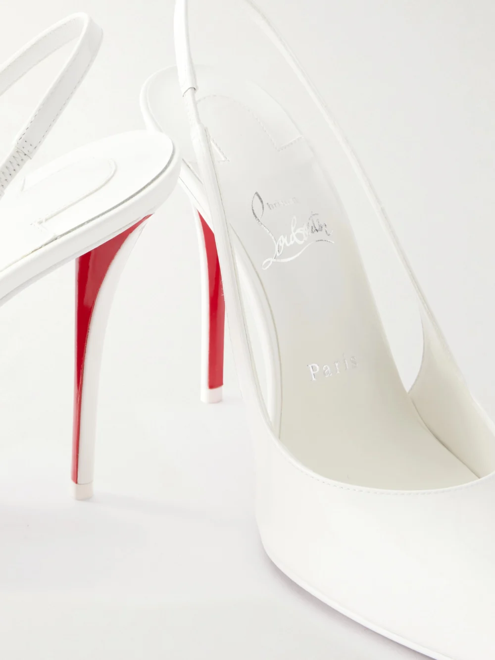 Close-up detail of the Christian Louboutin Miss Z 100 Patent-leather Slingback Pumps