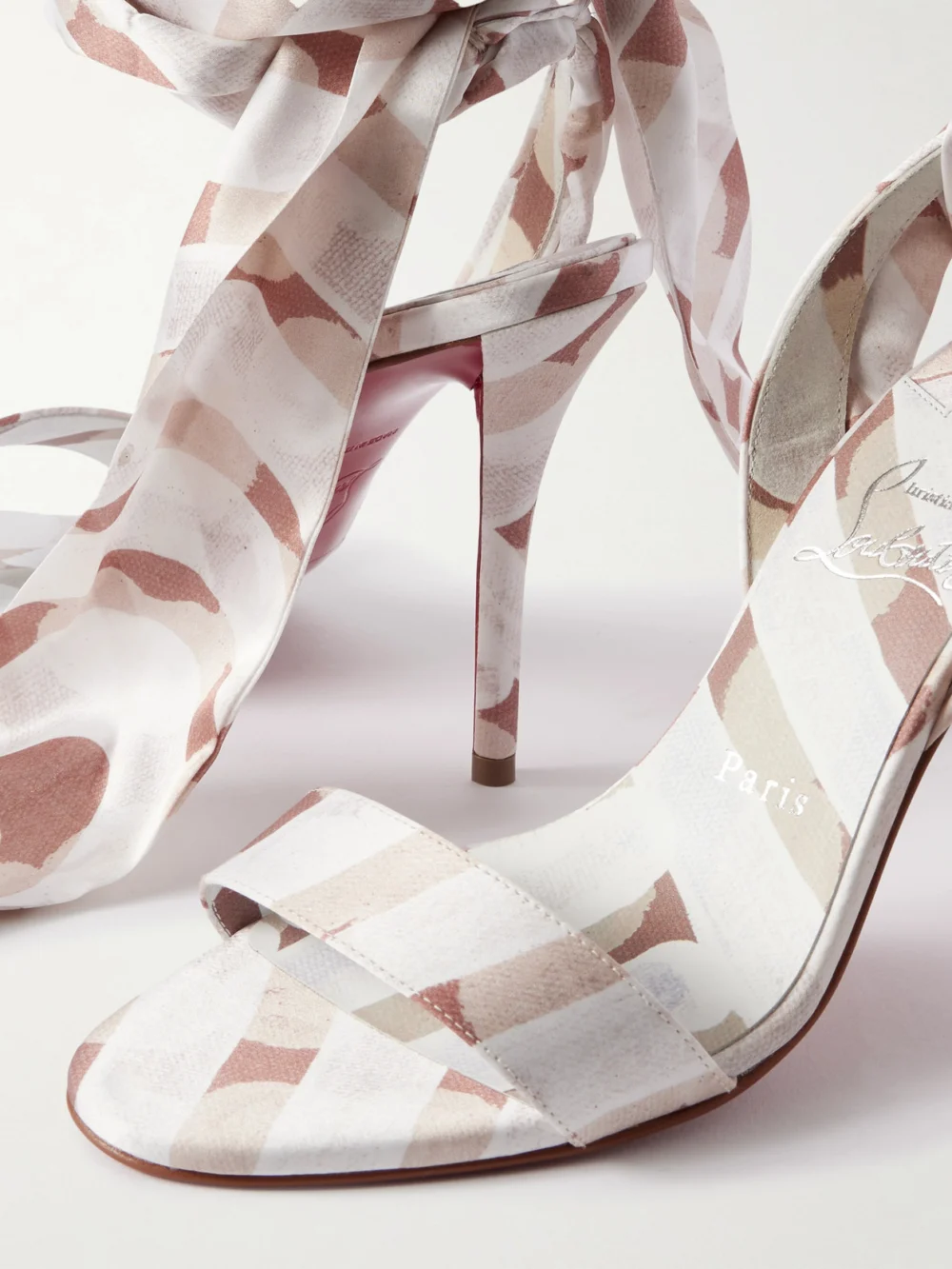Close-up detail of the Christian Louboutin Miss Z 100 Printed Satin Sandals