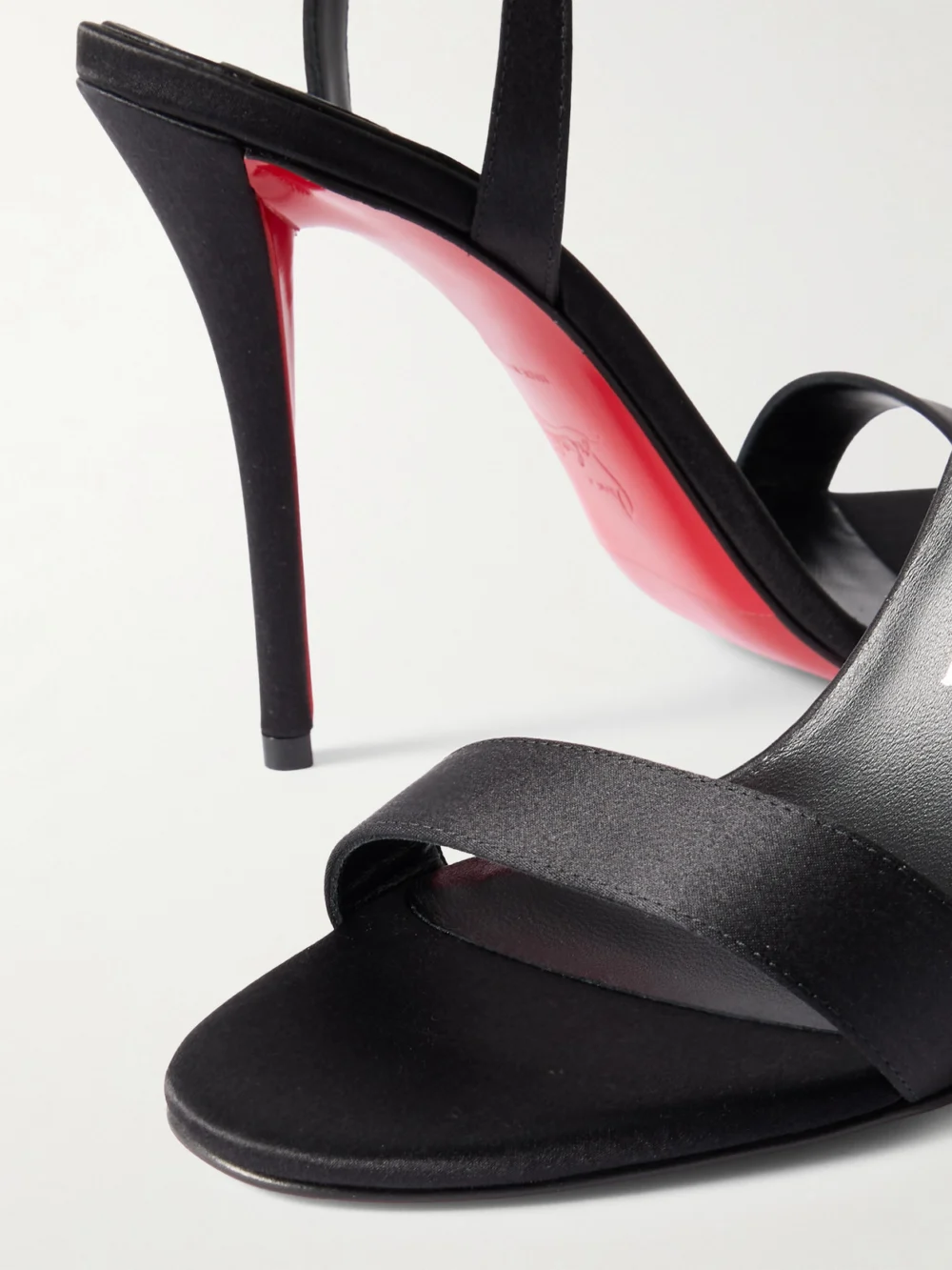 Close-up detail of the Christian Louboutin Miss Z 100 Satin Sandals