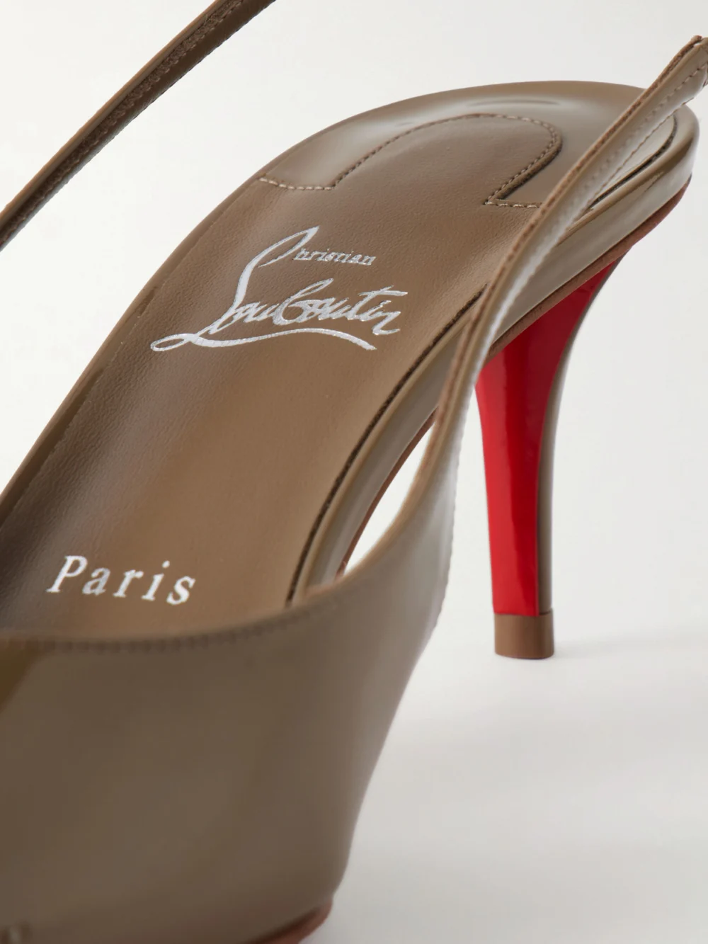 Close-up detail of the Christian Louboutin Miss Z 60 Patent-leather Slingback Pumps