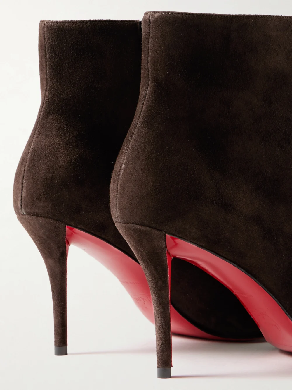 Close-up detail of the Christian Louboutin Miss Z 80 Suede Ankle Boots