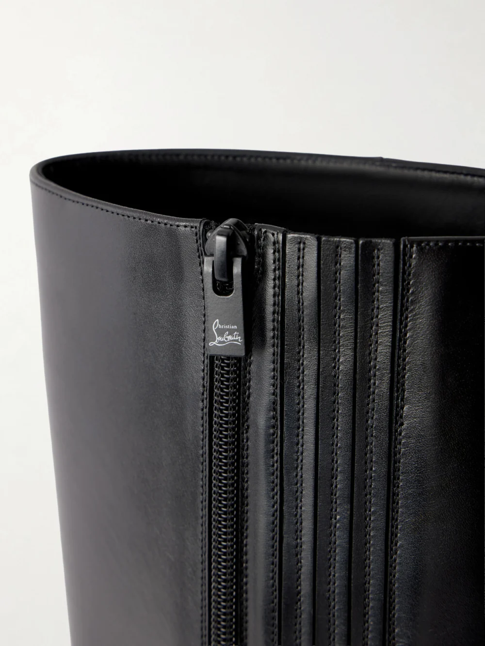 Close-up detail of the Christian Louboutin Miss Z Botta 80 Leather Knee Boots
