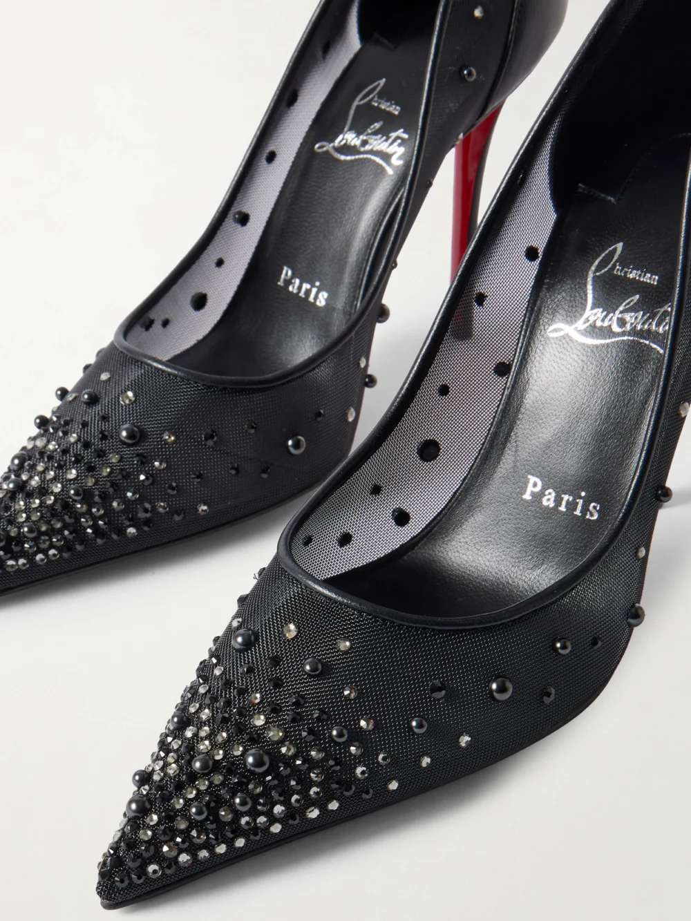 Close-up detail of the Christian Louboutin Miss Z Degrastrass Perla 100 Leather-trimmed Mesh Pumps