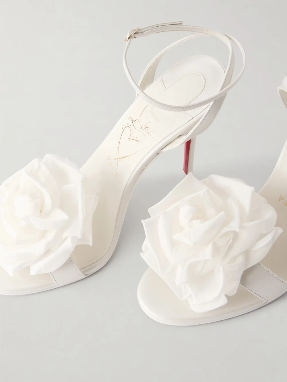 Close-up detail of the Christian Louboutin Miss Z Flora 100 Appliquéd Leather Sandals