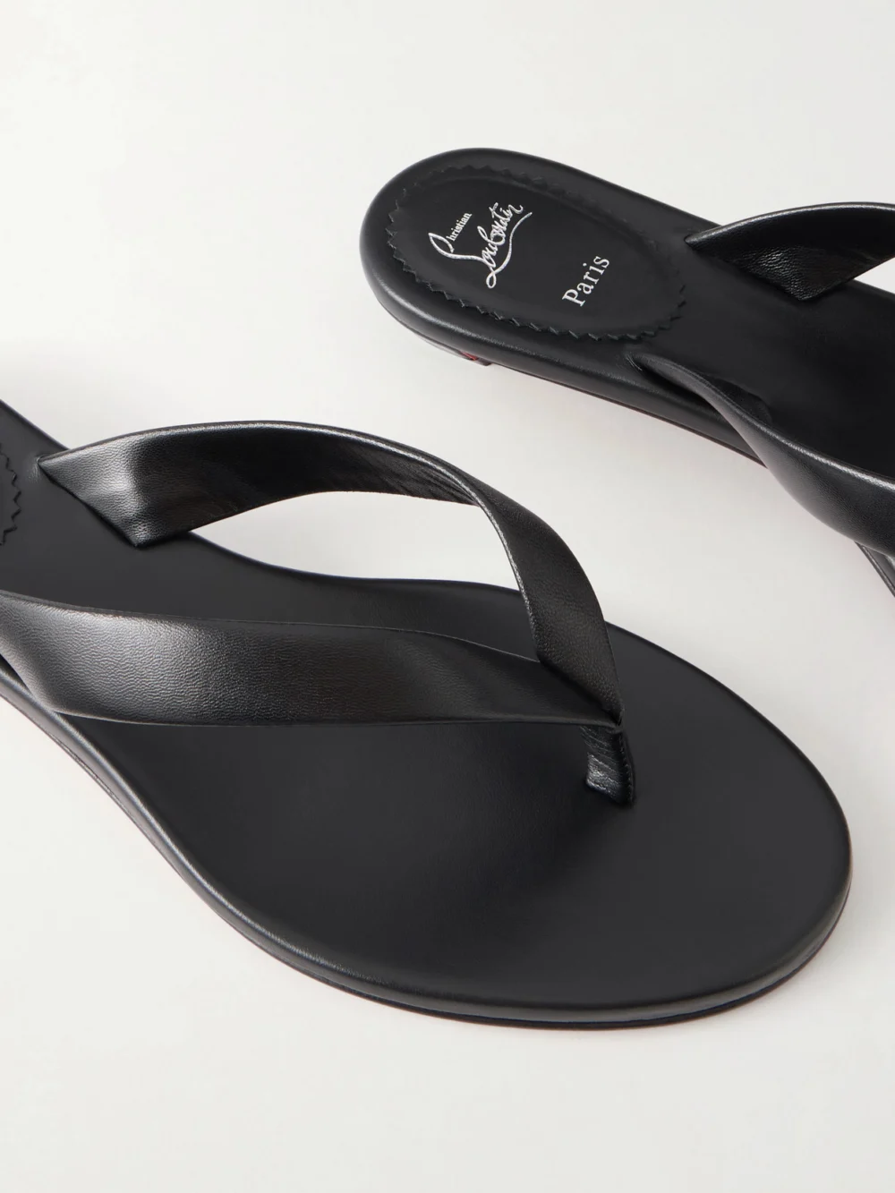 Close-up detail of the Christian Louboutin Miss Z Leather Thong Sandals