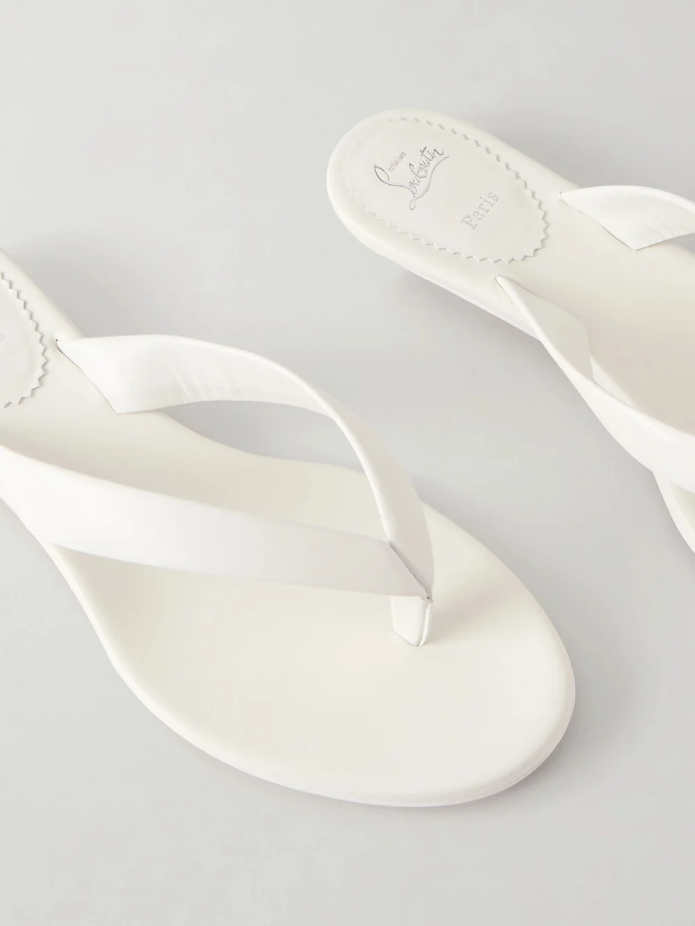 Close-up detail of the Christian Louboutin Miss Z Leather Thong Sandals
