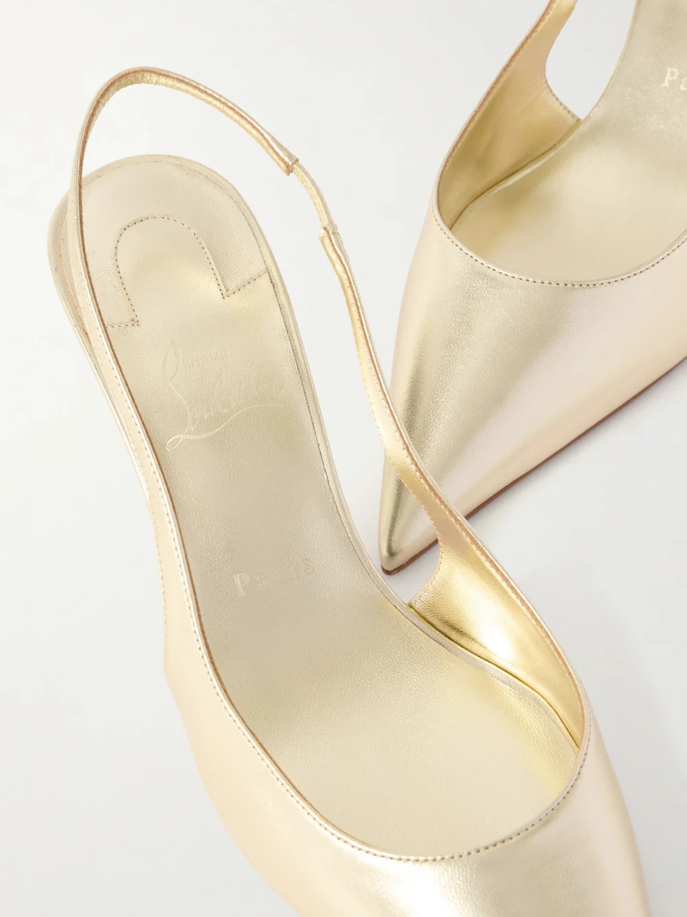 Close-up detail of the Christian Louboutin Miss Z Metallic Leather Slingback Pumps