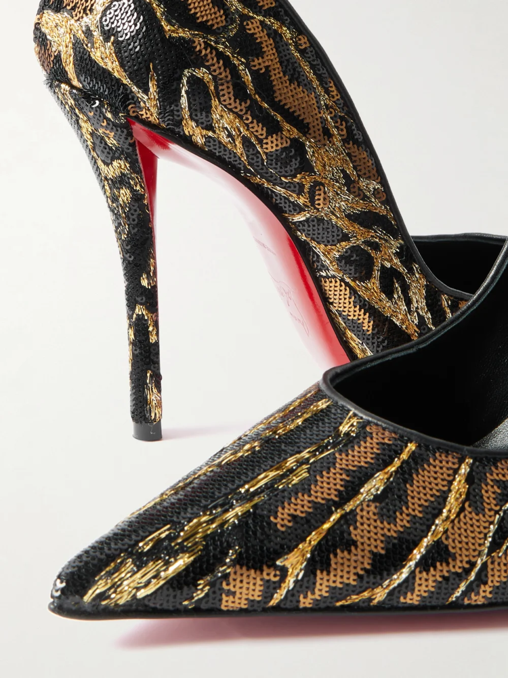 Close-up detail of the Christian Louboutin Miss Z Ocelot 100 Lurex and Leather-trimmed Sequined Satin Pumps