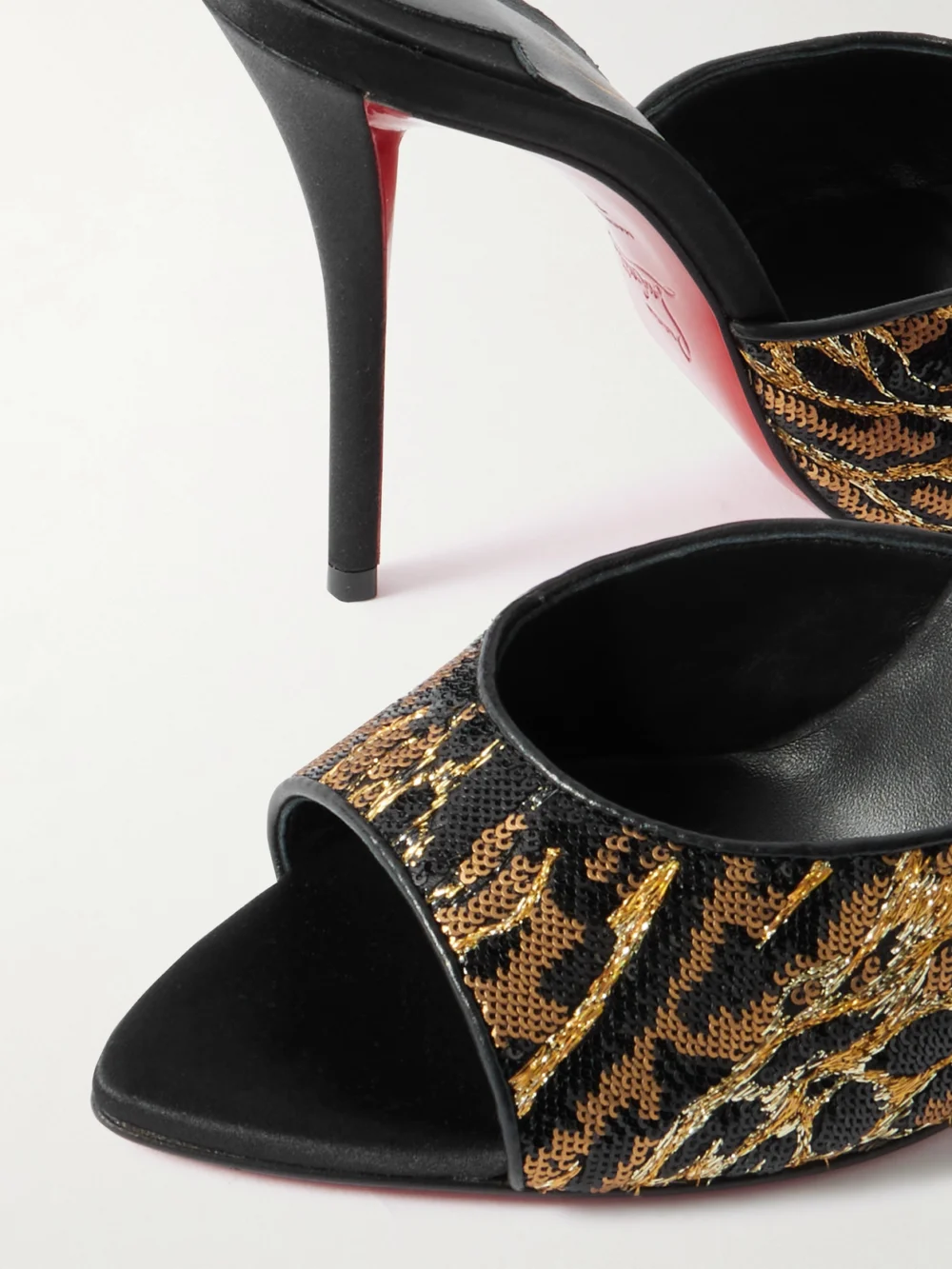Close-up detail of the Christian Louboutin Miss Z Ocelot Lurex and Leather-trimmed Sequined Satin Mules