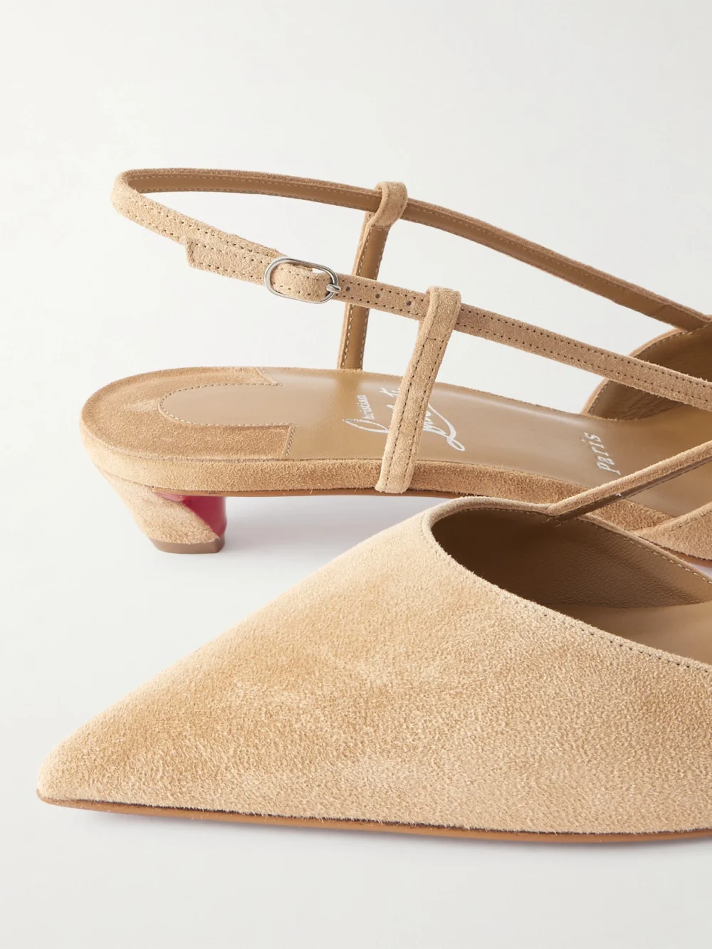 Close-up detail of the Christian Louboutin Miss Z Slingina 25 Suede Slingback Pumps