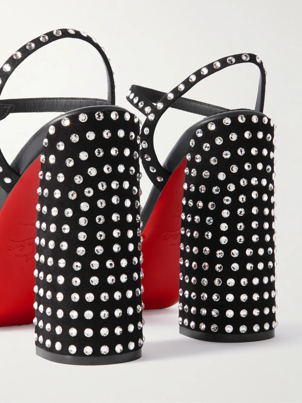 Close-up detail of the Christian Louboutin Movida Jane 130 Crystal-embellished Suede Platform Sandals