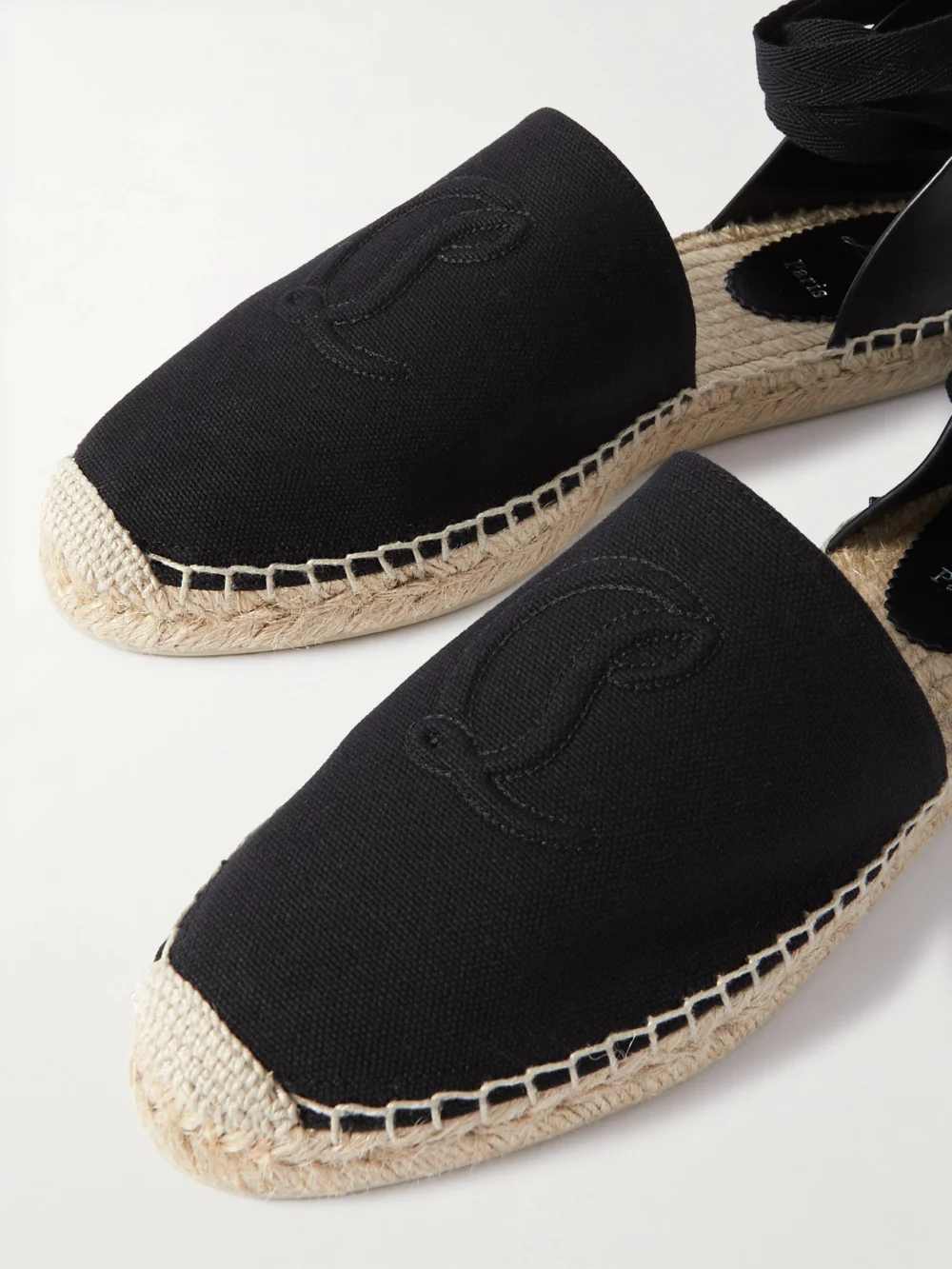 Close-up detail of the Christian Louboutin Nanou Lace Leather-trimmed Canvas Espadrilles