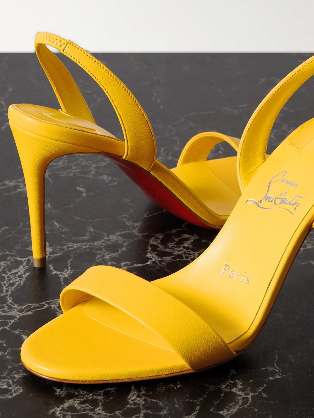 Close-up detail of the Christian Louboutin O Marylin 85 Leather Slingback Sandals