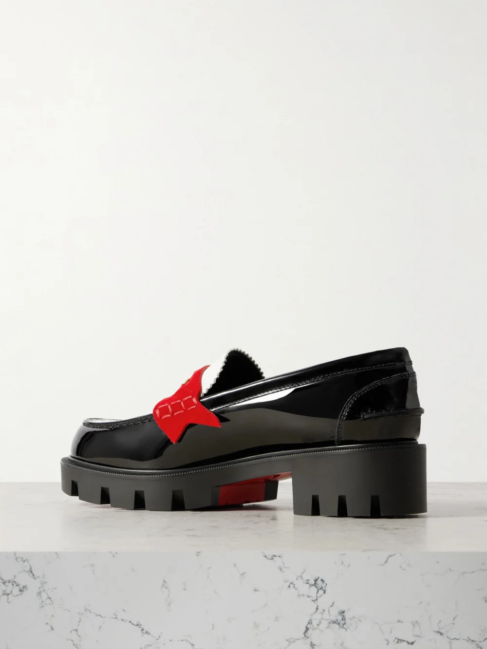 Back view of the Christian Louboutin Penny Velour-trimmed Leather Loafers