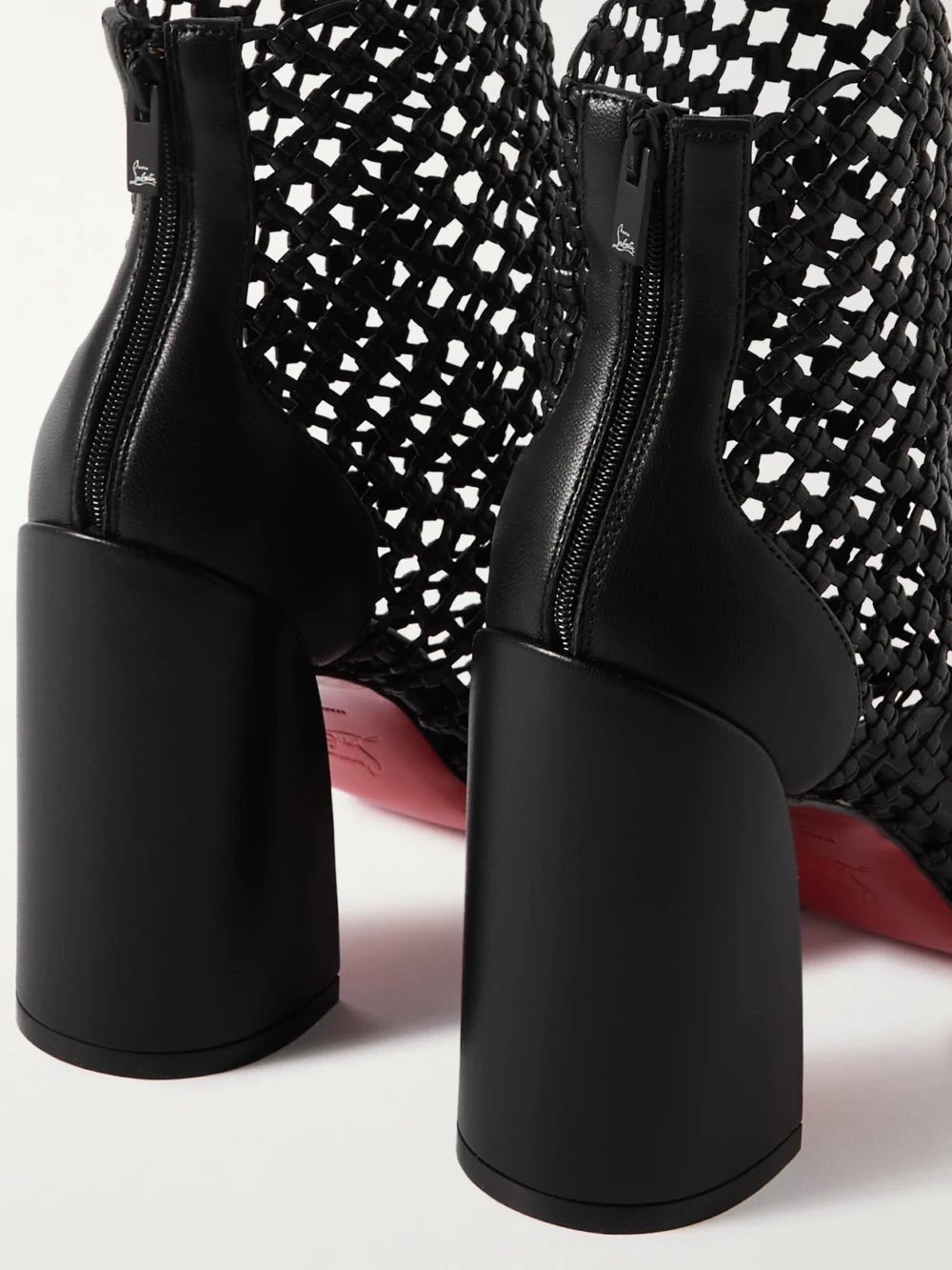Close-up detail of the Christian Louboutin Porlibooty Woven Leather Boots