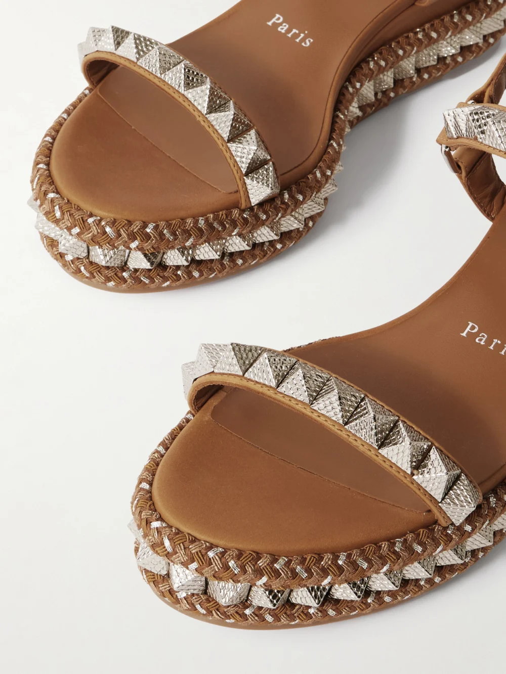 Close-up detail of the Christian Louboutin Pyraclou 60 Studded Leather Platform Sandals