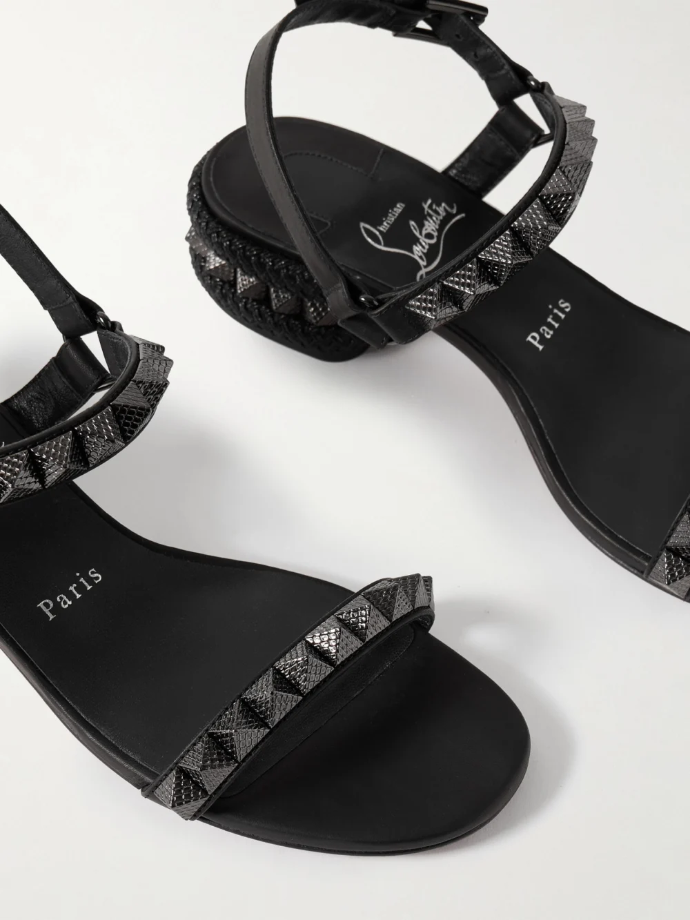 Close-up detail of the Christian Louboutin Pyrasand 30 Studded Leather Sandals