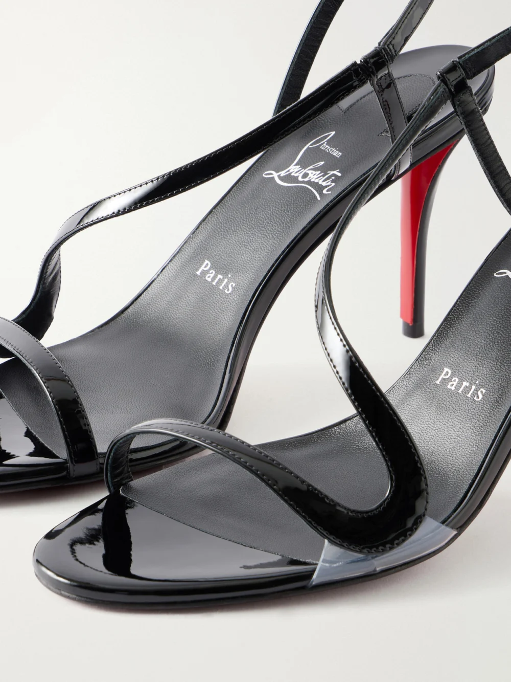 Close-up detail of the Christian Louboutin Rosa Z 80 Pvc-trimmed Patent-leather Sandals